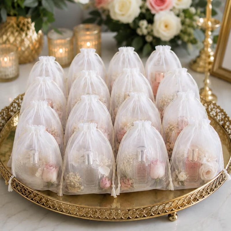 A large gold tray holding a pack of 12 white 5x7in muslin favor bags filled with perfume and flowers - thumbnail number 2