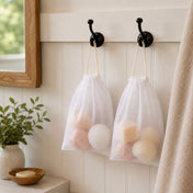 White 5x7in muslin favor bags hanging on bathroom wall hooks, filled with soaps and sponges - thumbnail number 7