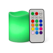 Small green LED pillar candle with remote on white background - thumbnail number 9