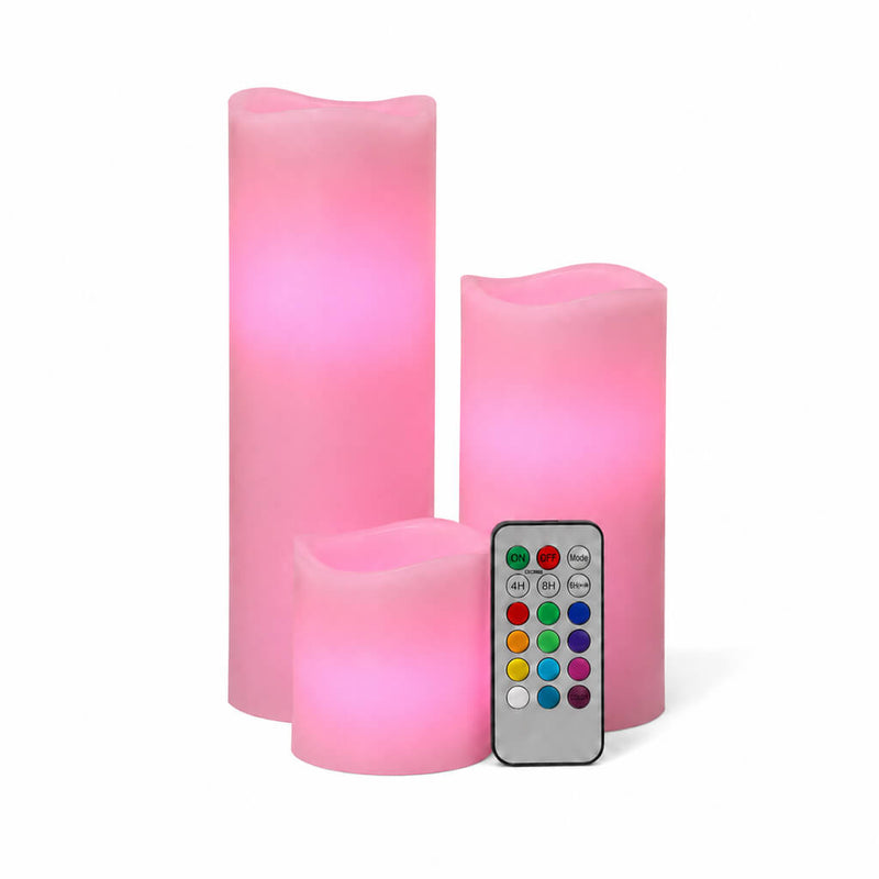 Pink LED candles in assorted sizes with remote on white surface - thumbnail number 3