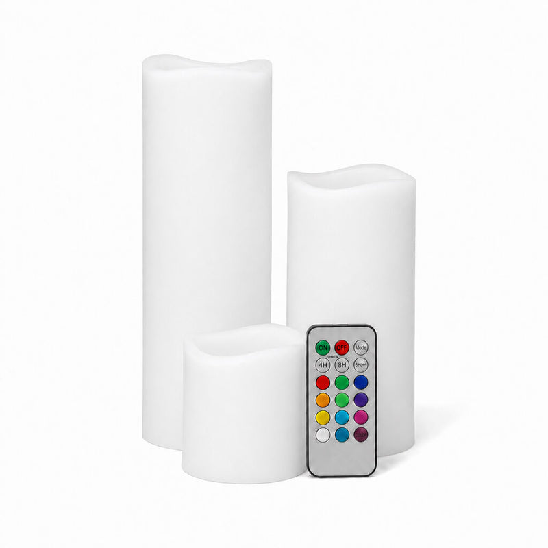 White LED pillar candles in different sizes with remote on white background - thumbnail number 1