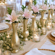 Henna Budvases with elegant pink lilies and greenery arranged on a wedding table - thumbnail number 6