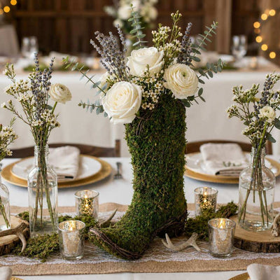 Natural preserved moss cowboy boot topiary pot as a wedding centerpiece - thumbnail number 4