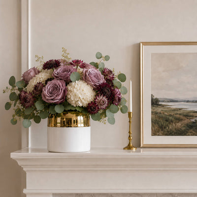 7.5" x 6.25" white and gold ceramic Claire pot filled with mauve roses and white hydrangeas on a mantel - thumbnail number 8