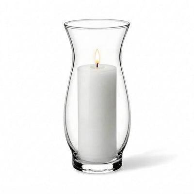 Lit white pillar candle inside a clear 6.5" hana vase on a white background - thumbnail number 3