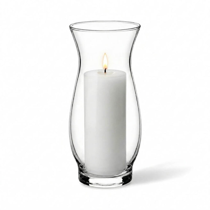 Lit white pillar candle inside a clear 6.5" hana vase on a white background - thumbnail number 3