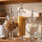 Apothecary jars holding pantry staples on wooden kitchen shelf - thumbnail number 6