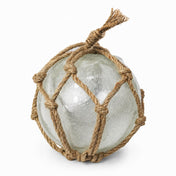 Japanese Nautical Float 6" Sea Glass sphere wrapped in knotted brown rope on white - thumbnail number 1