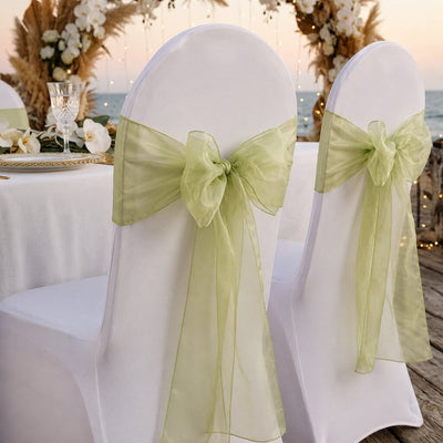 White chairs decorated with sage organza sashes tied in bows - thumbnail number 7