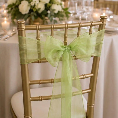 Gold chiavari chair decorated with a sage organza sash tied in a bow - thumbnail number 3