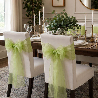 Upholstered dining chairs decorated with sage organza sashes tied in bows - thumbnail number 9