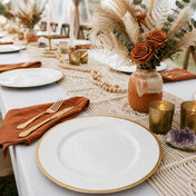 Boho-style tablescape with gold-rimmed plates - thumbnail number 3