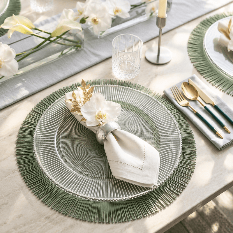13 inch silver rim glass charger plate on a green fringed placemat at a formal dinner table - thumbnail number 2