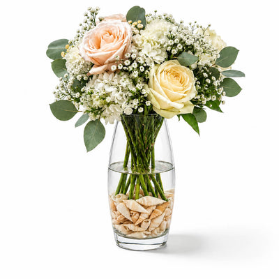 Flower bouquet with Conch Shell Vase Filler in a glass vase - thumbnail number 4