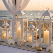 White contemporary metal lanterns with candles as centerpieces for a beach wedding - thumbnail number 3
