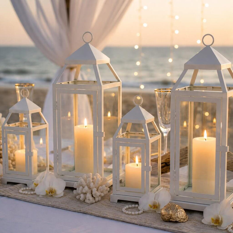 White contemporary metal lanterns with candles as centerpieces for a beach wedding - thumbnail number 3