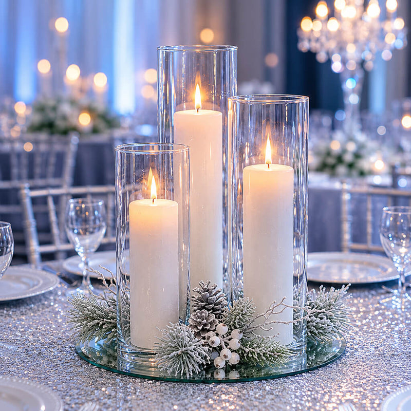 Three lit candles in glass vases with winter greenery on a glitter tabletop - thumbnail number 5
