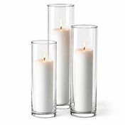 Three lit white pillar candles in staggered clear glass cylinder vases - thumbnail number 3
