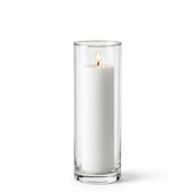 Lit white pillar candle inside a tall clear glass cylinder vase - thumbnail number 3