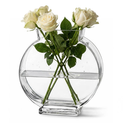 Clear circular vase filled with fresh white roses and water on a white background - thumbnail number 2