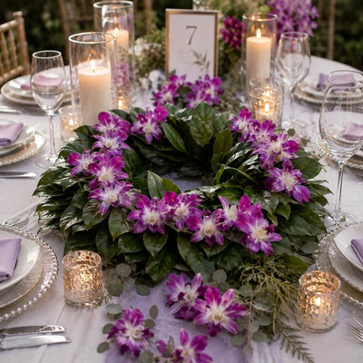 Magnolia wreath decorated with purple orchids on tablescape - thumbnail number 6