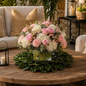 Pink flowers in glass vase on magnolia wreath - thumbnail number 9