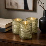 Pearly metallic gold mercury candle holders glowing on a modern wooden tabletop - thumbnail number 6