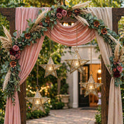 Decorative arch with pink drapes, floral arrangements, and star-shaped lanterns in an outdoor setting. - thumbnail number 6