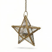 Star-shaped lantern with brass frame and clear glass on a white background - thumbnail number 1