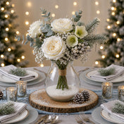 White rose bouquet in a glass vase on a wooden slice for a winter wonderland theme - thumbnail number 5