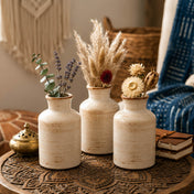 Three rustic ceramic vases with dried flowers on a carved wood table - thumbnail number 7