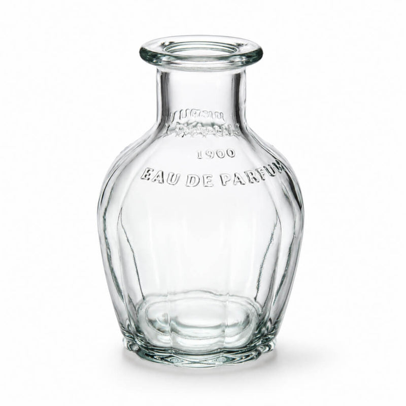 Vintage French parfum glass bottle with fluted design on a white background - thumbnail number 1
