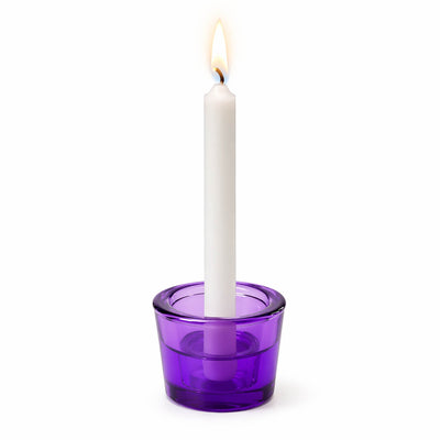 Lit white taper candle in a purple glass holder - thumbnail number 5