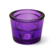 Empty purple glass votive holder on a white background - thumbnail number 1