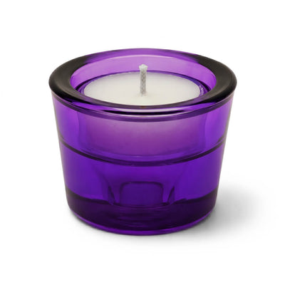 White tea light candle in a purple glass holder on a white background - thumbnail number 2