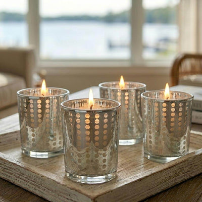 Silver dotted glass votive holders with lit candles on rustic wood tray - thumbnail number 8
