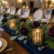 Gold dotted glass candle holders with plum flowers and greenery on a navy velvet table runner - thumbnail number 5
