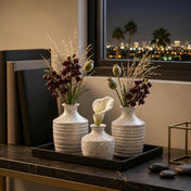 Speckled bud vases with dark flowers and a white calla lily - thumbnail number 5