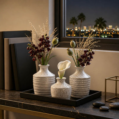 Speckled bud vases with dark flowers and a white calla lily - thumbnail number 5
