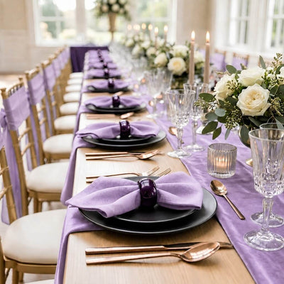 A 2.3-inch eggplant purple napkin ring holding a light purple napkin on a long table setting - thumbnail number 6