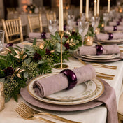 A 2.3-inch eggplant napkin ring holding a napkin on a table setting - thumbnail number 3