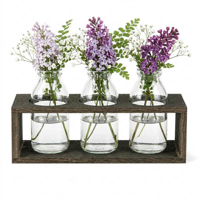 Vintage milk bottle vases with flowers in a wooden stand - thumbnail number 3