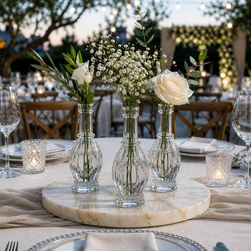 White roses and baby's breath in Bubble Bud vases on an outdoor setting - thumbnail number 3