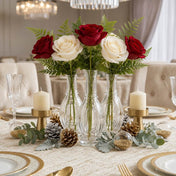 Red and white roses in clear vintage bubble bud vases with candles on a table - thumbnail number 5