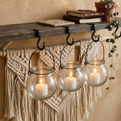 Three lit votive candles in a Bubble Hanging Glass Vase suspended from a rustic shelf - thumbnail number 9