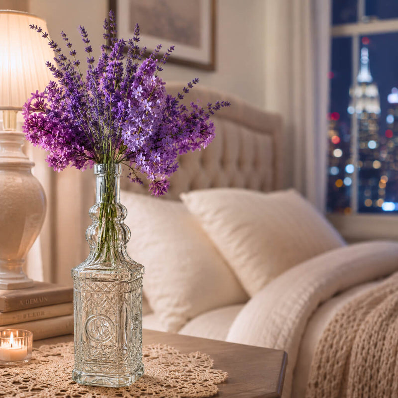 Decorative glass bottle vase with purple flowers in a bedroom - thumbnail number 6