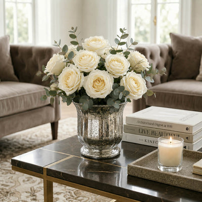 Silver Mercury Venus Jar filled with white roses on a marble table in a living room - thumbnail number 7