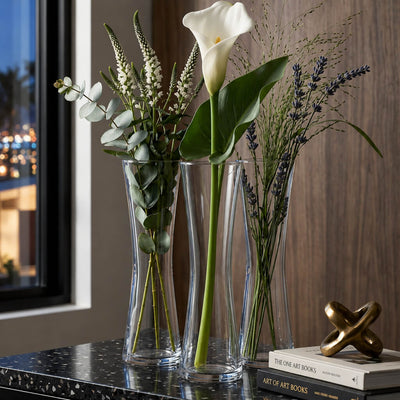 Three 8" Sabrina bud vases with tall stems of calla lily, eucalyptus, and lavender on a table - thumbnail number 6