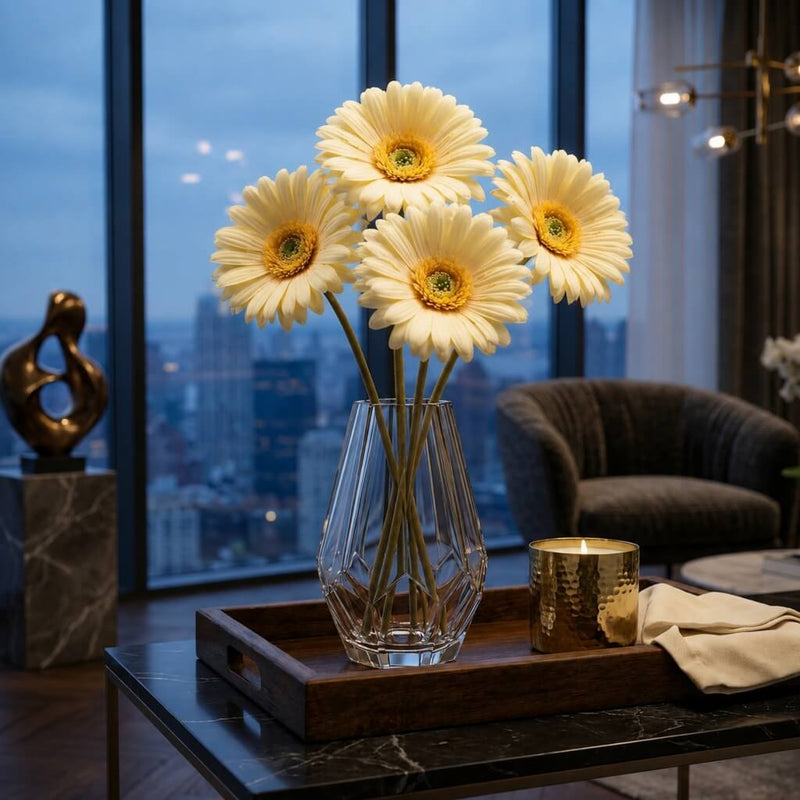 Five pale yellow 24" gerbera daisies in a geometric vase on a wooden tray in a high-rise apartment - thumbnail number 8