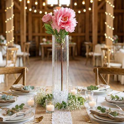 A 22-inch pink peony spray in a glass cylinder vase as a centerpiece on a wedding table - thumbnail number 3